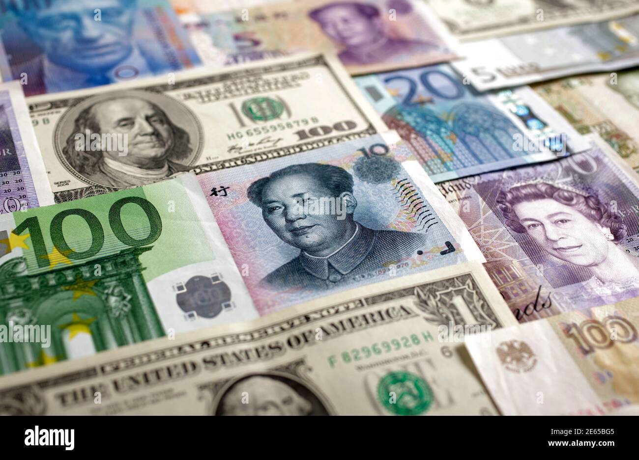Arrangement of various world currencies including Chinese Yuan, Japanese  Yen, US Dollar, Euro, British Pound, Swiss Franc and Russian Rouble  pictured in Warsaw, January 26, 2011. REUTERS/Kacper Pempel (POLAND - Tags:  BUSINESS