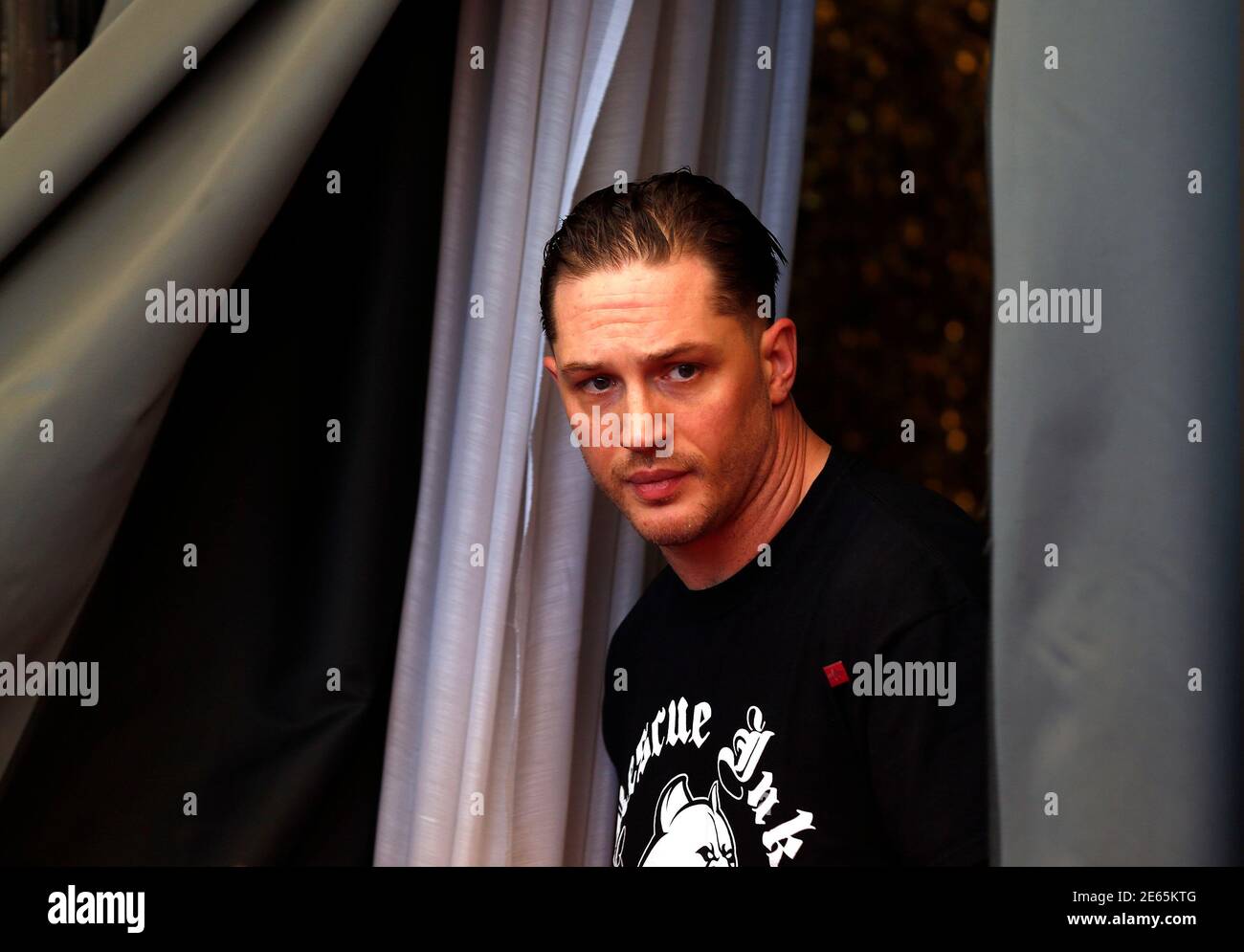 Cast member Tom Hardy is pictured during a photocall for the movie 'Locke', directed by Steven Knight, during the 70th Venice Film Festival in Venice September 2, 2013. REUTERS/Alessandro Bianchi (ITALY - Tags: ENTERTAINMENT HEADSHOT) Stock Photo