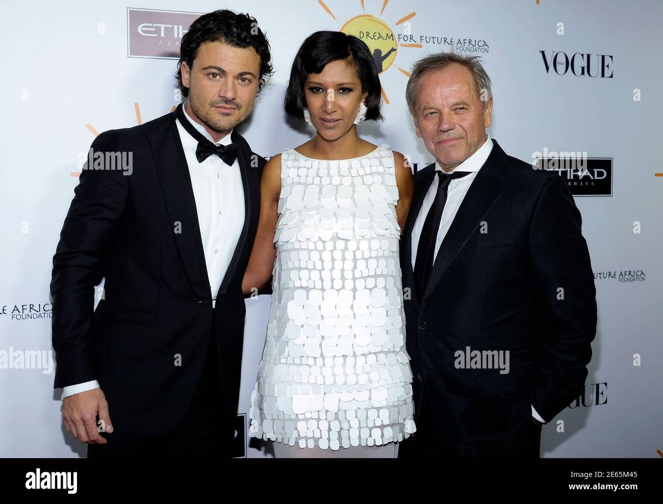 Italian operatic tenor Vittorio Grigolo (L-R), host Gelila Assefa and her husband, celebrity chef Wolfgang Puck, attend the Dream For Future Africa Foundation inaugural gala to honor Franca Sozzani, Vogue Italia Editor-In-Chief, in Beverly Hills ,California, October 24, 2013.  REUTERS/Kevork Djansezian  (UNITED STATES - Tags: ENTERTAINMENT FOOD) Stock Photo