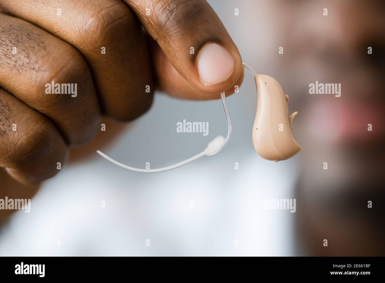 Hearing Aid For Deaf Disabled African Man Stock Photo Alamy