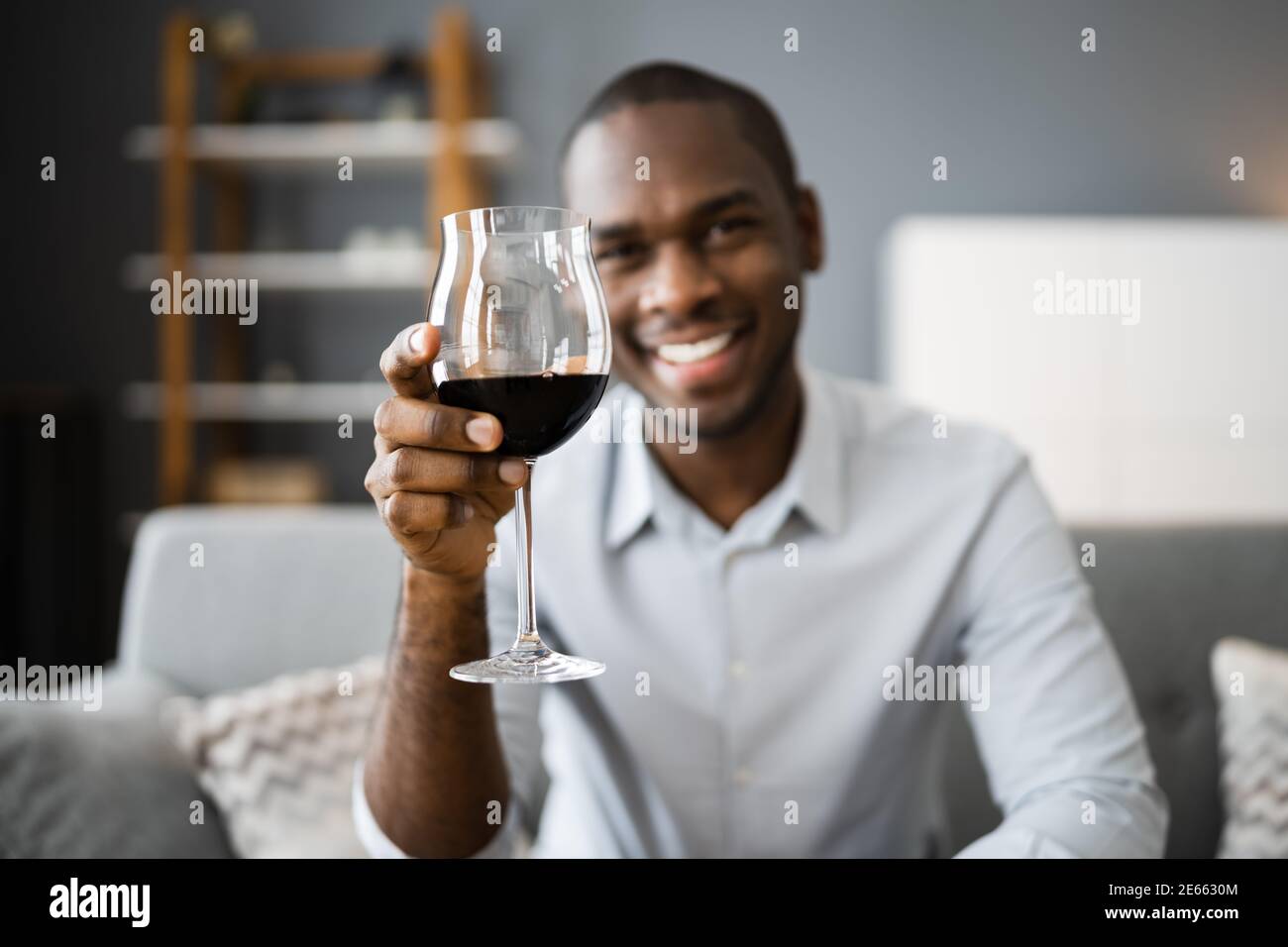 Man Drinking Red Wine In Video Conference At Home Stock Photo - Alamy