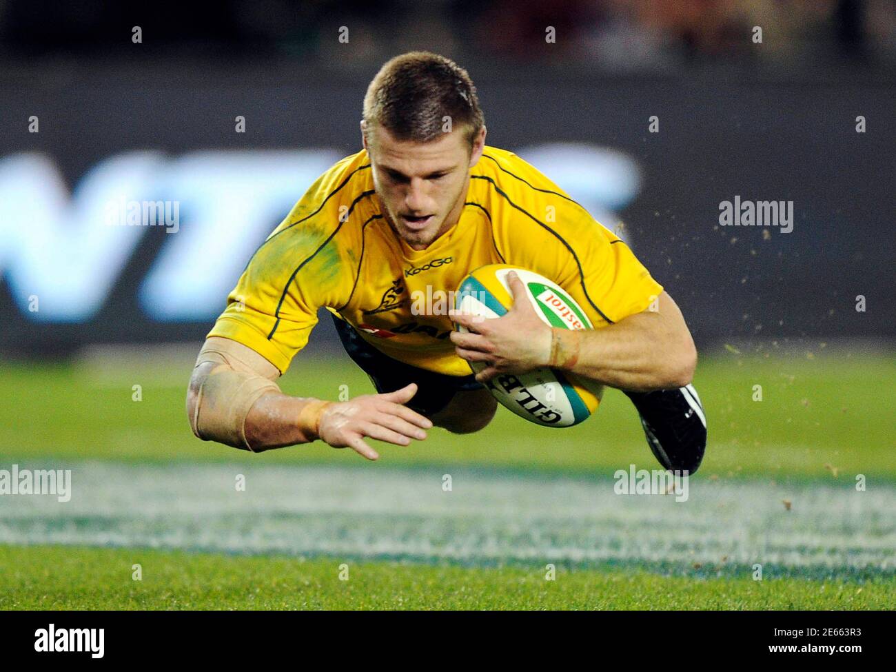 Australia's Rob Horne scores a try during their international rugby test match against Wales in Melbourne June 16, 2012. REUTERS/Mal Fairclough (AUSTRALIA - Tags: SPORT RUGBY) Stock Photo