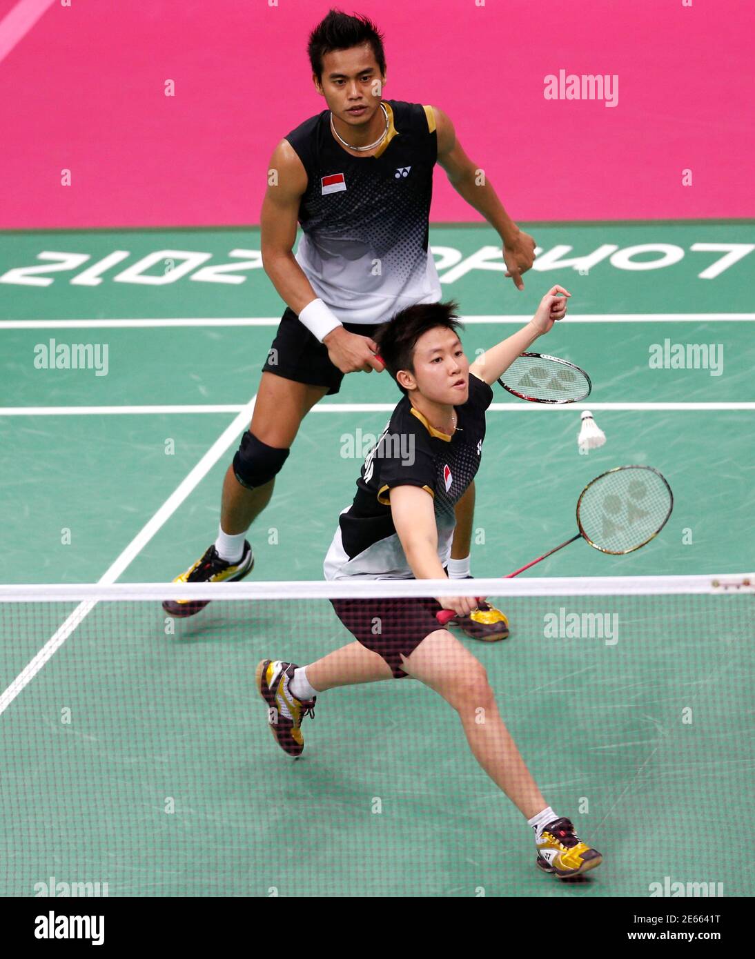 Indonesia's Liliyana Natsir (front) and Tontowi Ahmad play against  Denmark's Christinna Pedersen and Denmark's Joachim Fischer during their  mixed doubles badminton bronze medal match during the London 2012 Olympic  Games at the