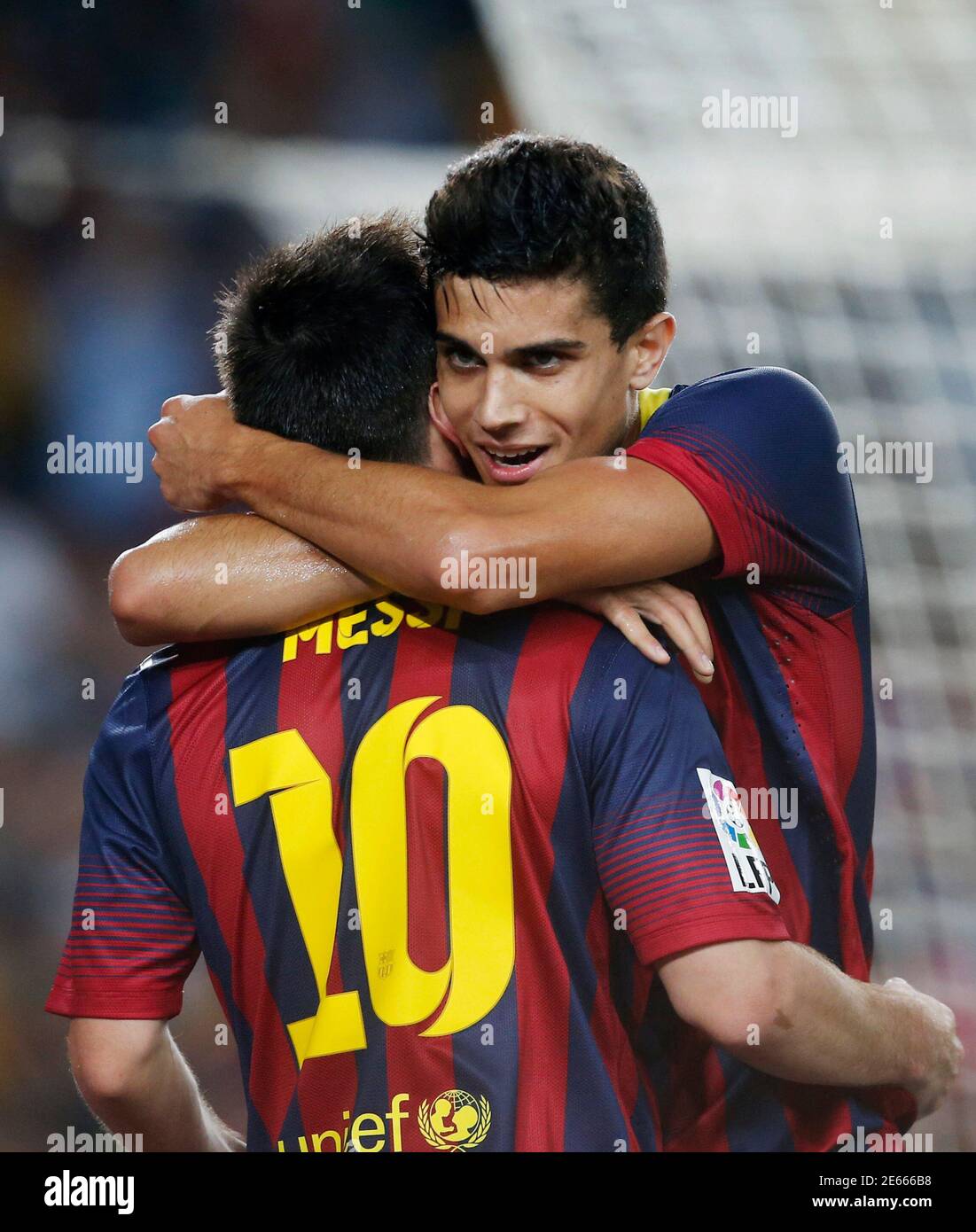 Barcelona's Marc Bartra and Lionel Messi (10) celebrate a goal against Real  Sociedad during their Spanish First division soccer league match at Camp  Nou stadium in Barcelona September 24, 2013. REUTERS/Albert Gea (