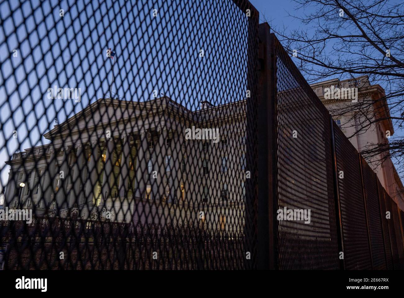 Washington, United States. 28th Jan, 2021. A high security fence is seen surrounding the U.S. Treasury Building in Washington, DC on Thursday, January 28, 2021. President Biden has asked the director of national intelligence to draw up a comprehensive threat assessment on domestic violent extremism in the country as the new administration seeks to tackle what it calls a 'serious and growing national security threat.' Photo by Ken Cedeno/UPI Credit: UPI/Alamy Live News Stock Photo