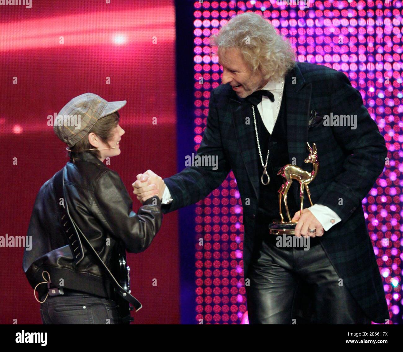 German Entertainer Thomas Gottschalk R Receives The Trophy For Best Tv Event Of The Year From Hagen Brueggemann During The 63rd Bambi Media Awards Ceremony In Wiesbaden November 10 2011 Every Year