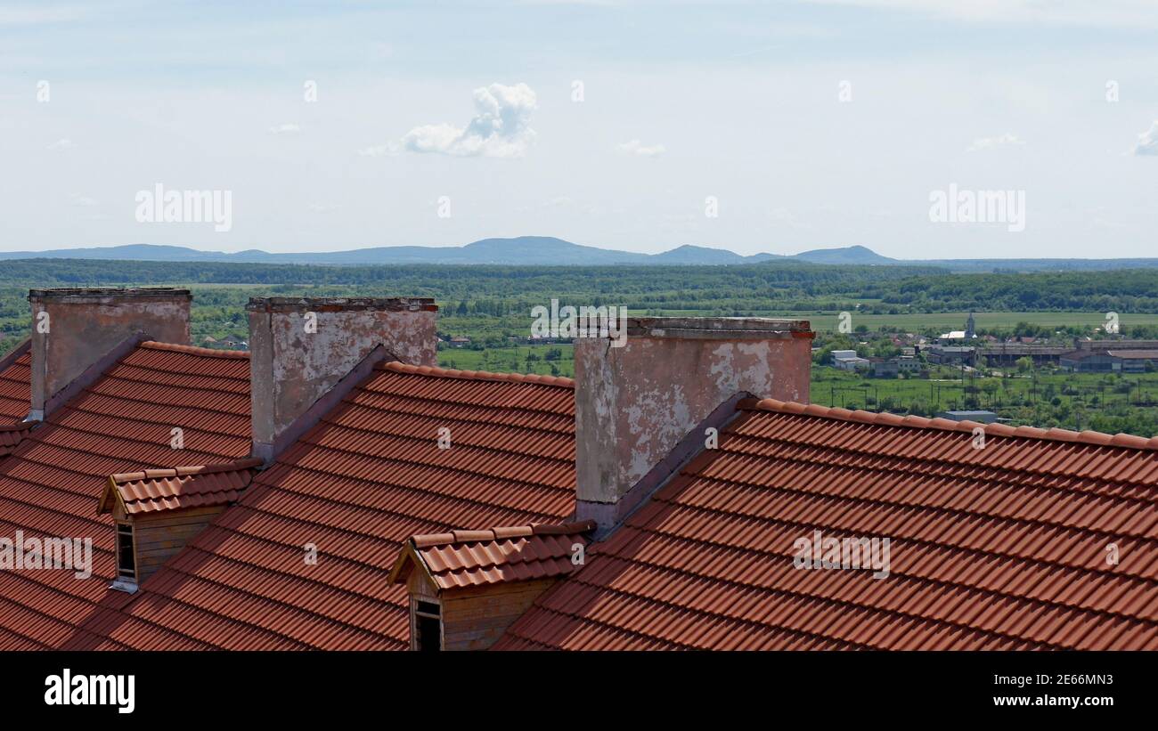 tiled roof and old chimneys part of the castle building on the ...