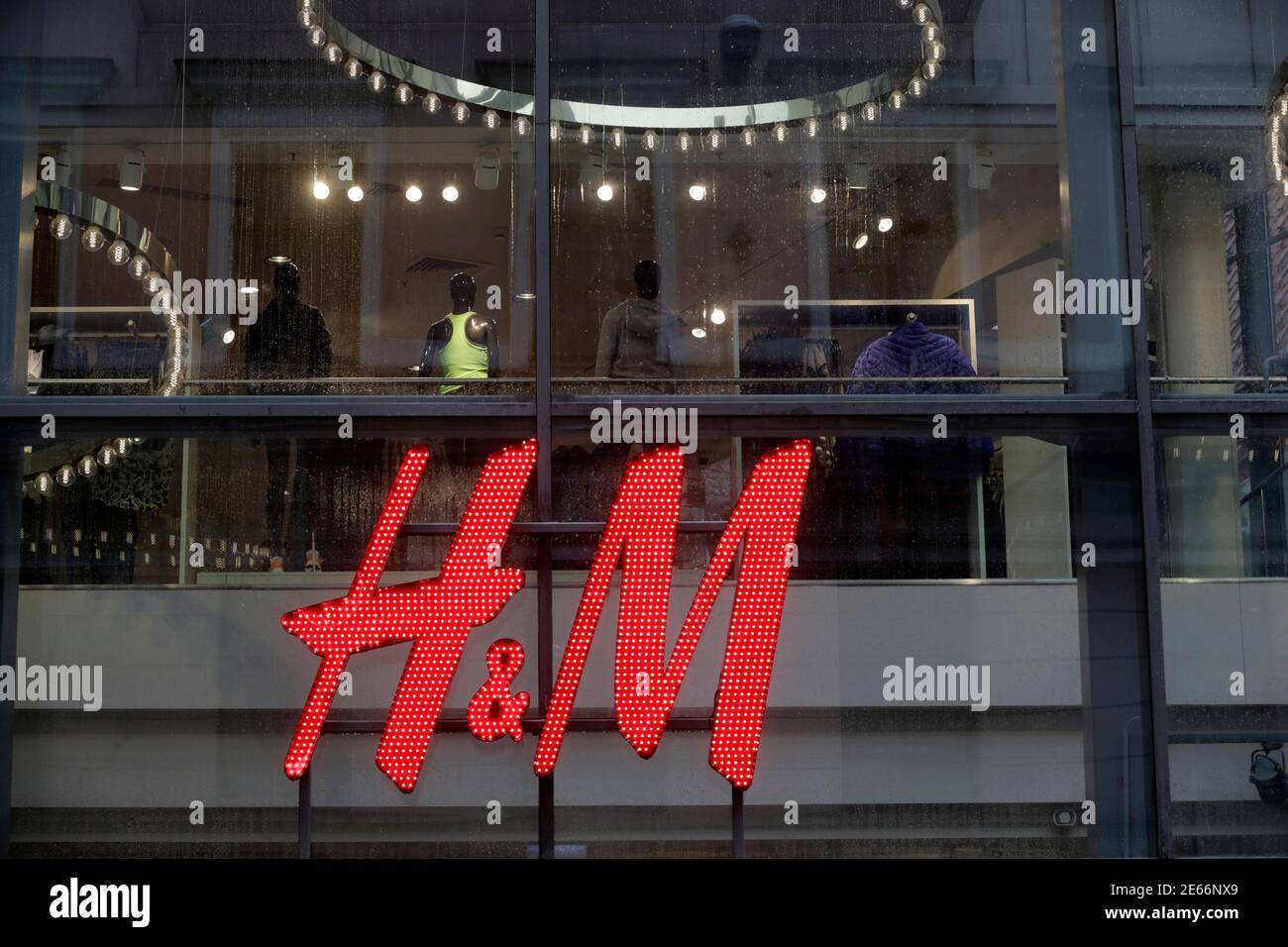 A H&M logo is pictured at its store in Riga September 25, 2013. Swedish  fashion retailer Hennes & Mauritz looked to put a poor run of form behind  it on Thursday as