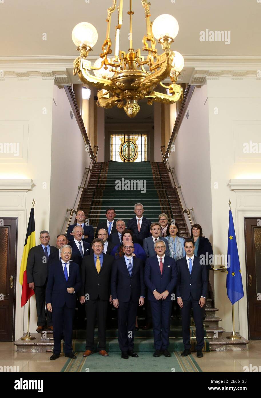 Belgium's new Prime Minister Charles Michel (front C) poses for a group photo with members of the new Belgian government at Belgian Parliament in Brussels October 11, 2014. Belgium's new federal government is formed by a centre-right coalition of liberals, Christian Democrats and a Flemish regional, including Flemish nationalist party N-VA.   REUTERS/Francois Lenoir (BELGIUM  - Tags: POLITICS) Stock Photo