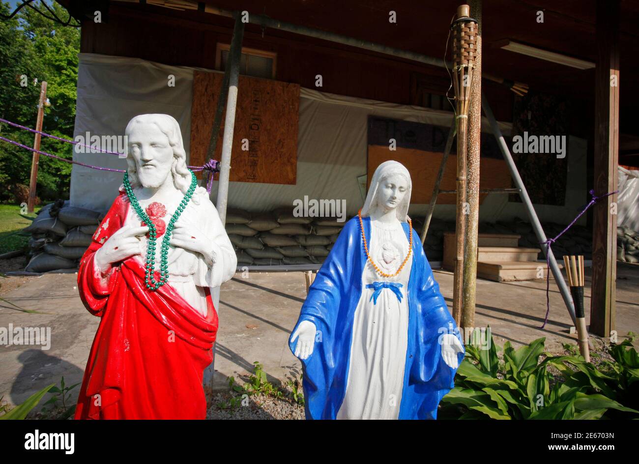Religious statues sit in front of a sandbagged, empty house in the Happy Town section of Butte LaRose, Louisiana May 19, 2011. The town, within the Atchafalaya Basin, is expected to flood up to several feet in coming days. REUTERS/Lee Celano (UNITED STATES - Tags: ENVIRONMENT RELIGION) Stock Photo