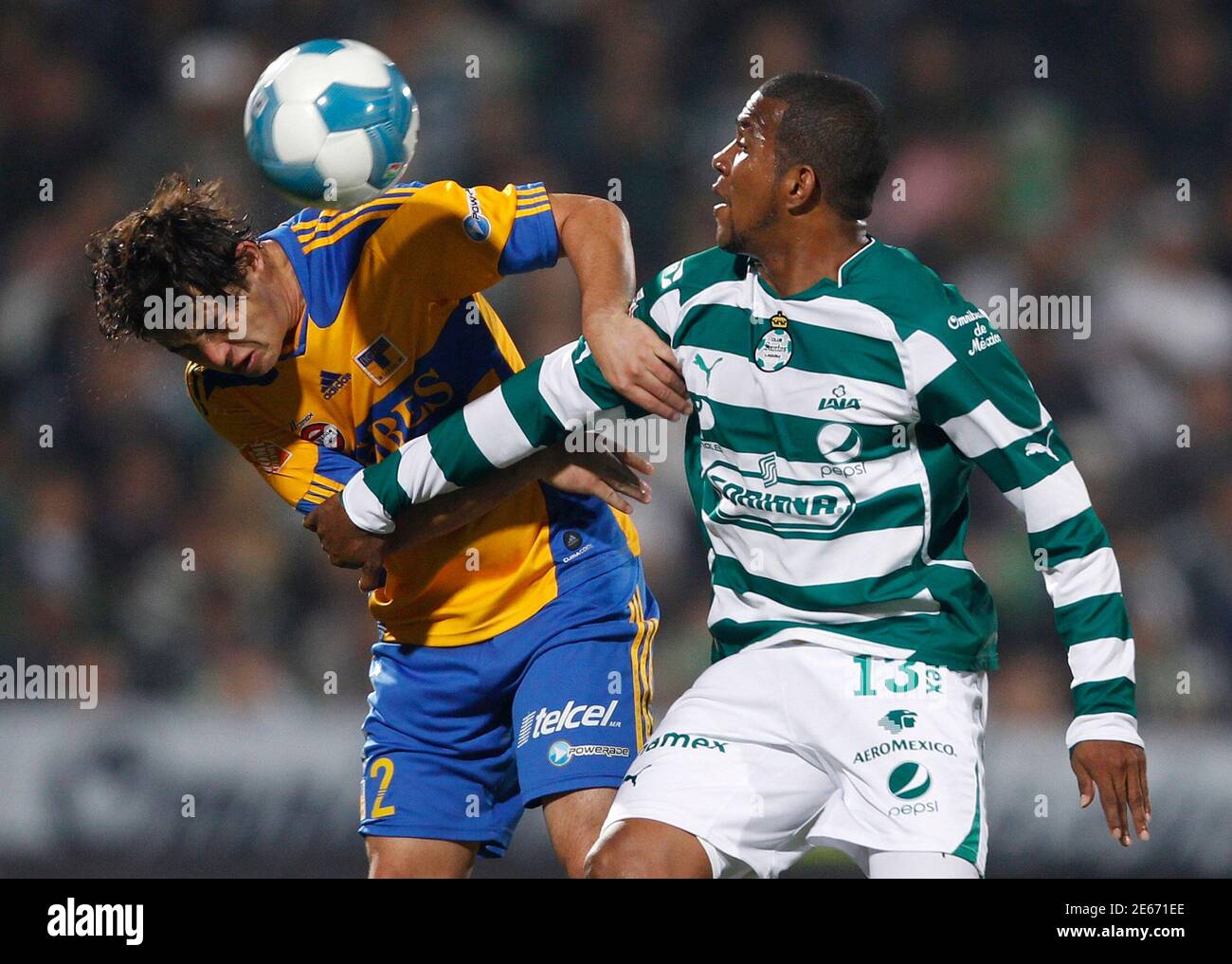 Tigres Israel Jimenez L Battles For The Ball With Santos Christian Suarez During Their Mexican League Championship Final First Leg Soccer Match At The Tsm Corona Stadium In Torreon December 8 2011