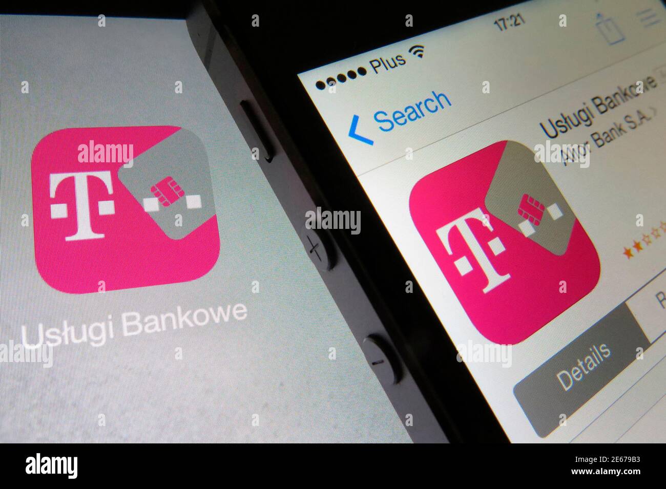 Mobile phone (R) displaying an open T-mobile banking service application  lies on a tablet screen with the same icon in this illustration picture  taken in Warsaw June 17, 2014. Polish banks and