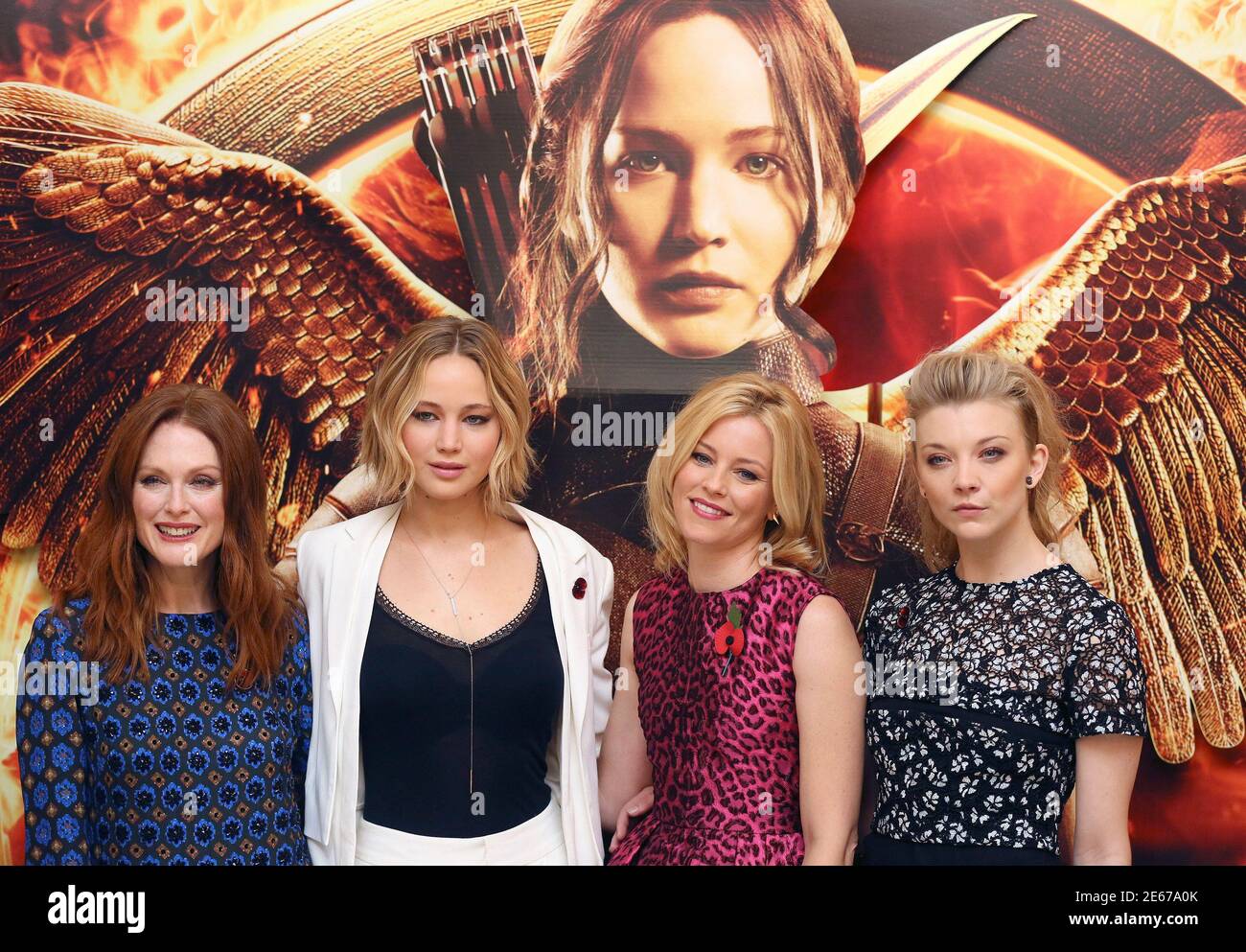 L-R) Actresses Julianne Moore, Jennifer Lawrence, Elizabeth Banks and  Natalie Dormer attend the photocall for 'The Hunger Games: Mockingjay Part  1', in London, November 9, 2014. REUTERS/Paul Hackett (BRITAIN - Tags:  ENTERTAINMENT