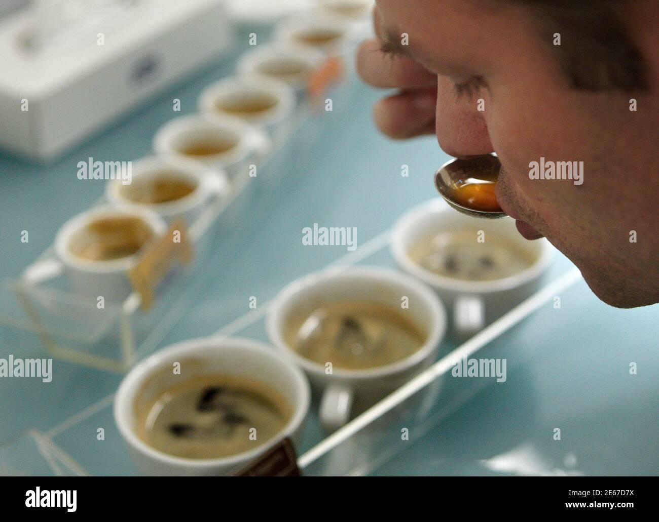 A coffee specialist tastes the quality of finished product at Nespresso  production and distribution center in Avenches near Bern May 24, 2011.  Nespresso, one of the fastest growing brand of Nestle group,