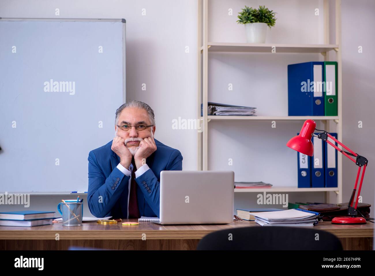 Male boss employee working in the office Stock Photo - Alamy