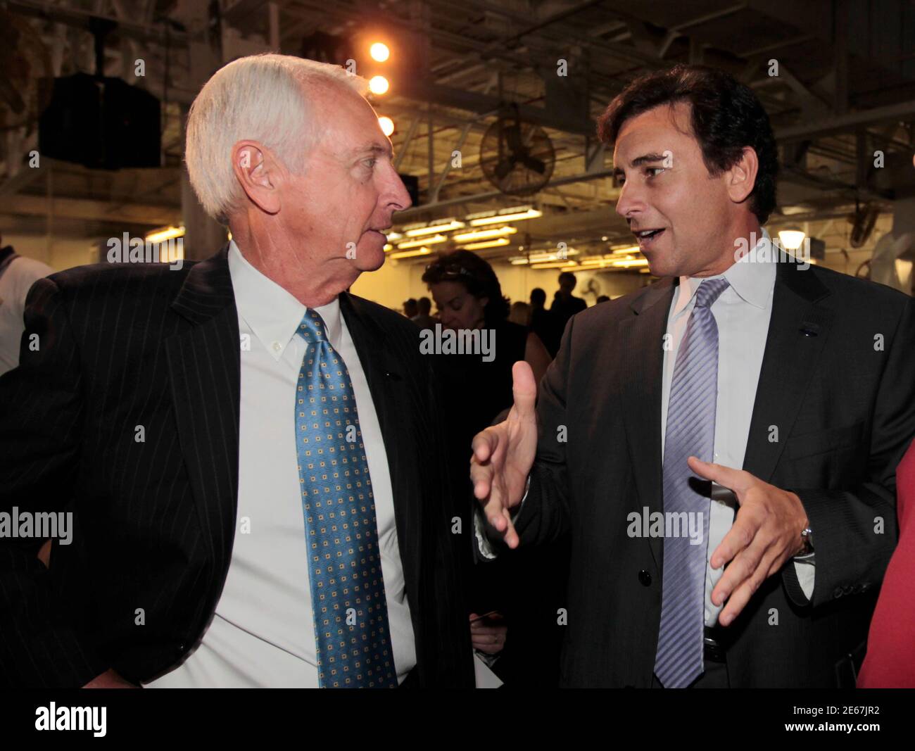 Kentucky Governor Steve Beshear (L) talks with Ford Motor Company's Mark Fields (R), Ford's president of the Americas, during a news conference to celebrate the start of production of Ford's new 2013 Ford Escape at the company's transformed Louisville Assembly Plant in Louisville, Kentucky, June 13, 2012.    REUTERS/John Sommers II      (UNITED STATES - Tags: BUSINESS TRANSPORT POLITICS) Stock Photo