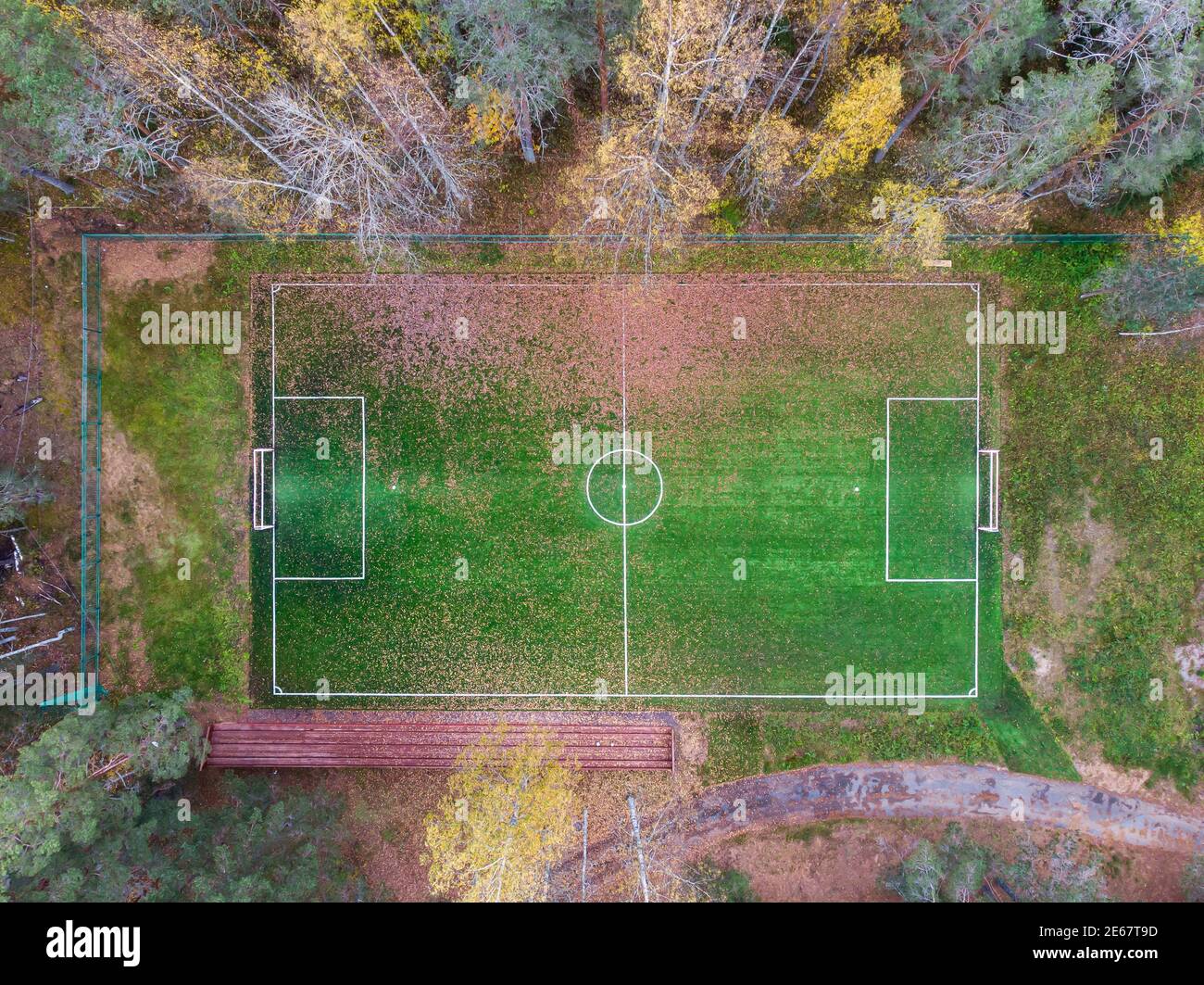 Aerial drone view of football soccer pitch field, green grass fall