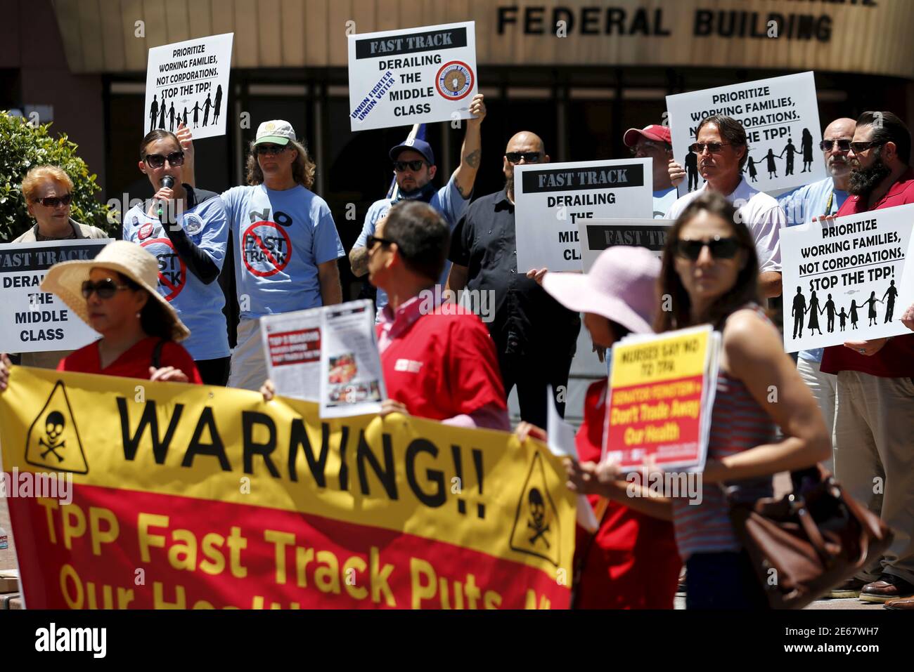 Nurses rally outside the offices of Senator Dianne Feinstein's office to urge her to vote against the fast track authority of the Trans- Pacific Partnership in San Diego, California June 22, 2015. The nurses say the trade agreement will endanger the environment and public health by allowing pharmaceutical companies to raise the cost of medications and overturn environmental and food safety regulations. REUTERS/Mike Blake Stock Photo
