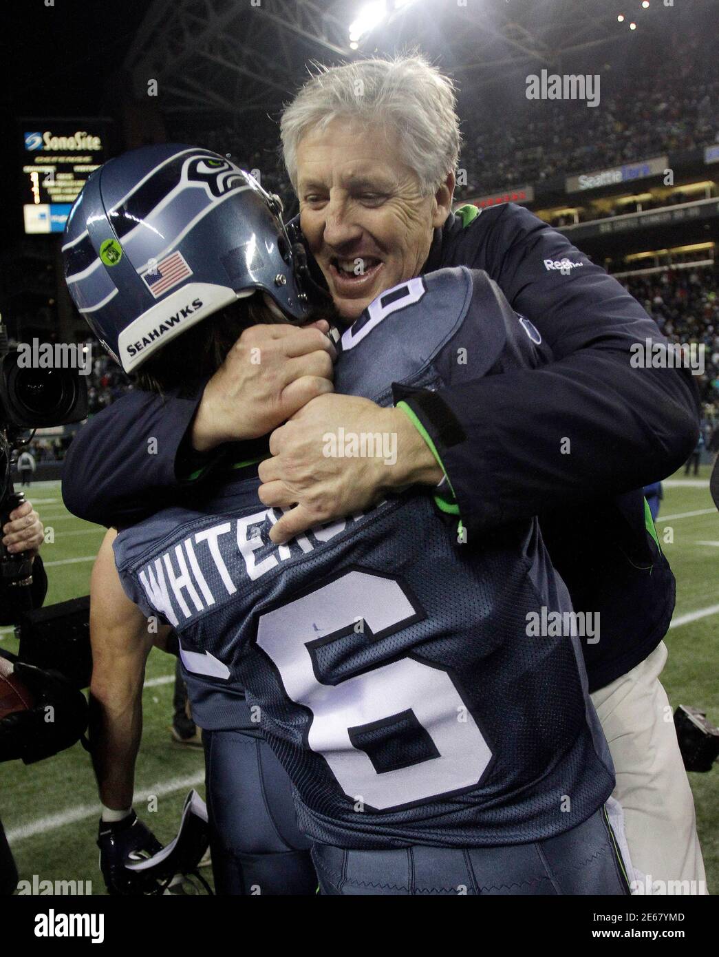 Seattle Seahawks head coach Pete Carroll congratulates quarterback Charlie Whitehurst after the team's win over the St Louis Rams to clinch the NFC West in Seattle, Washington, January 2, 2011. REUTERS/Robert Sorbo (UNITED STATES - Tags: SPORT FOOTBALL) Stock Photo