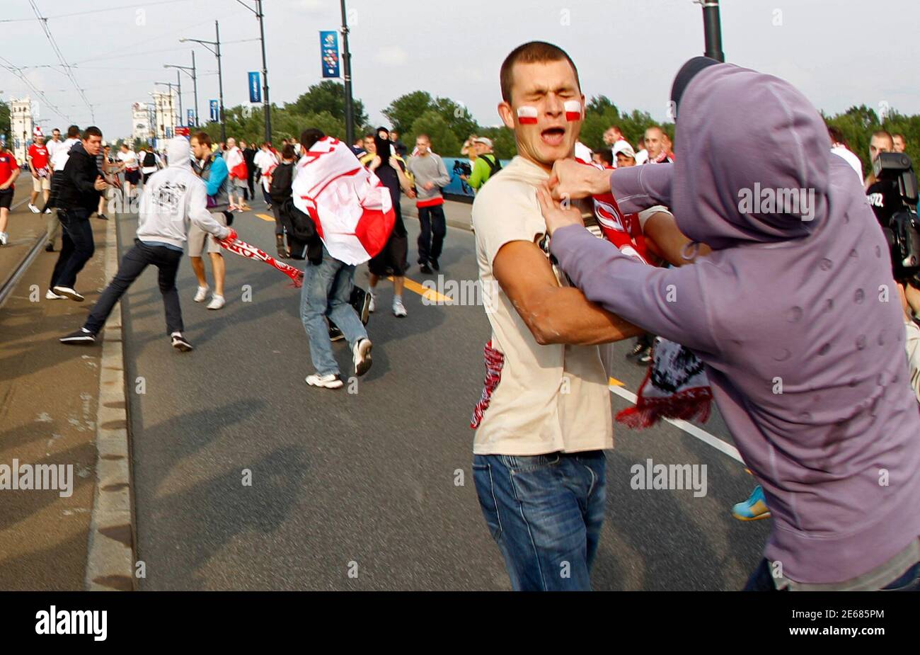 A Russian Soccer Fan R Fights With A Polish Supporter In Warsaw June 12 12 Russia Will Play Poland In Their Euro 12 Group A Soccer Tournament On Tuesday Reuters Peter Andrews Poland