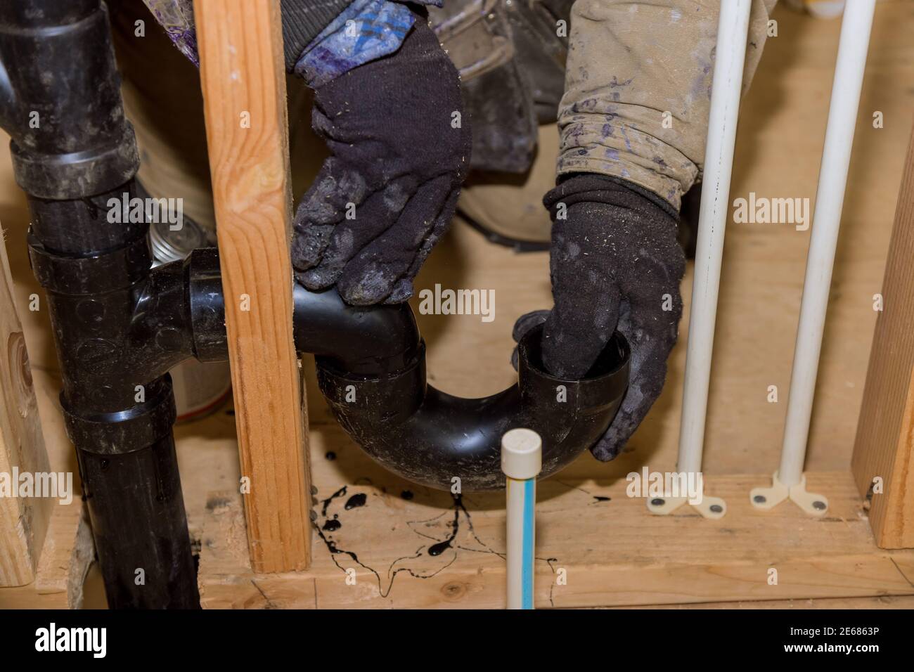 Worker Is Using Glue With Fitting For Installing The Pvc Drain Pipe In The Work Area Stock Photo Alamy
