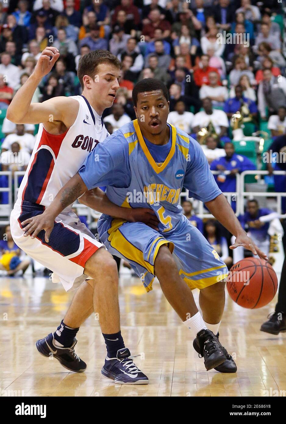 Gonzaga guard Kevin Pangos (4) defends Southern University guard Jameel  Grace (5) during the first half of their second round NCAA tournament  basketball game in Salt Lake City, Utah, March 21, 2013.