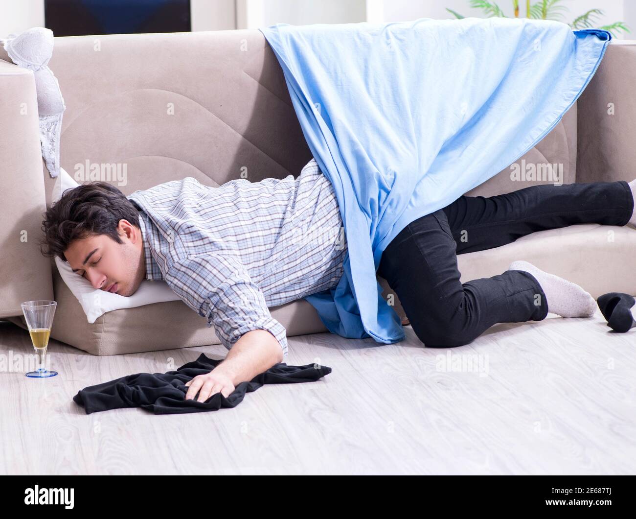 The man with mess at home after house party Stock Photo