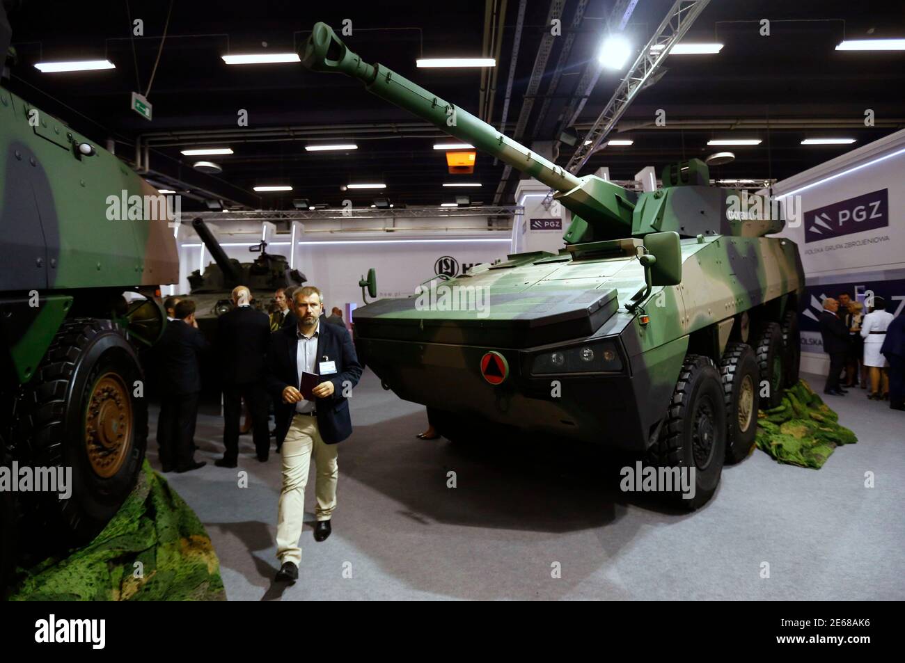 The Cockerill XC-8 105 hp low-weight concept-turret is seen on an armored modular vehicle at the stand of Huta Stalowa Wola (HSW), part of the Polish Armaments Group (PGZ), during an international military fair in Kielce, southern Poland September 2, 2014. Poland on Wednesday brought small defence manufacturers into a consortium big enough to bid, alongside foreign majors, for a share of the country's $40 billion military modernisation pot. The PGZ, set to comprise over 30 companies ranging from a shipyard to a high-tech graphene manufacturer, will allow the country's fragmented industry to co Stock Photo