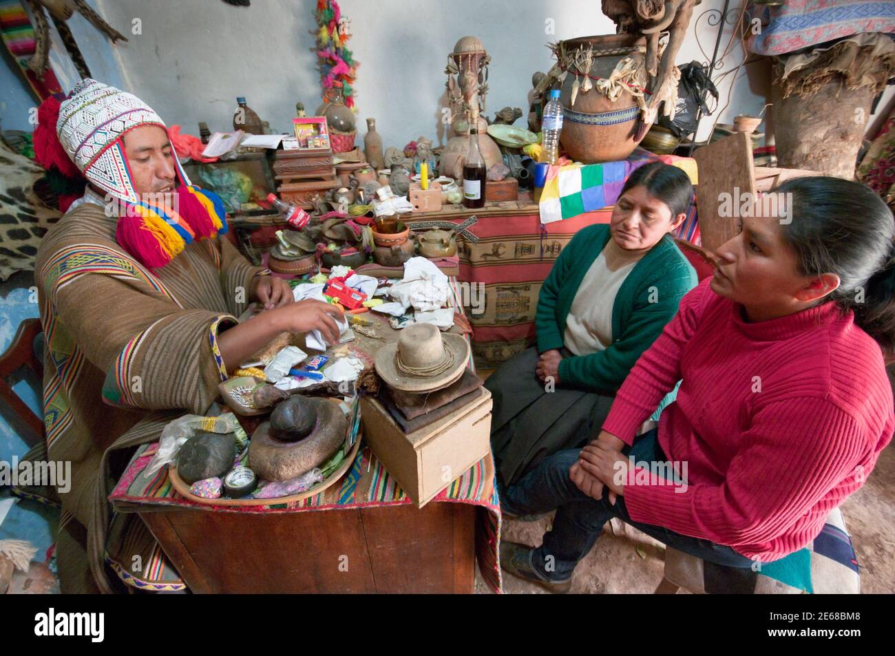 Huasao, Peru - August 17th 2011:  Andean priest 'Chaman', perform a sacred 'Despacho' ceremony to heal serious family problems of the client Stock Photo