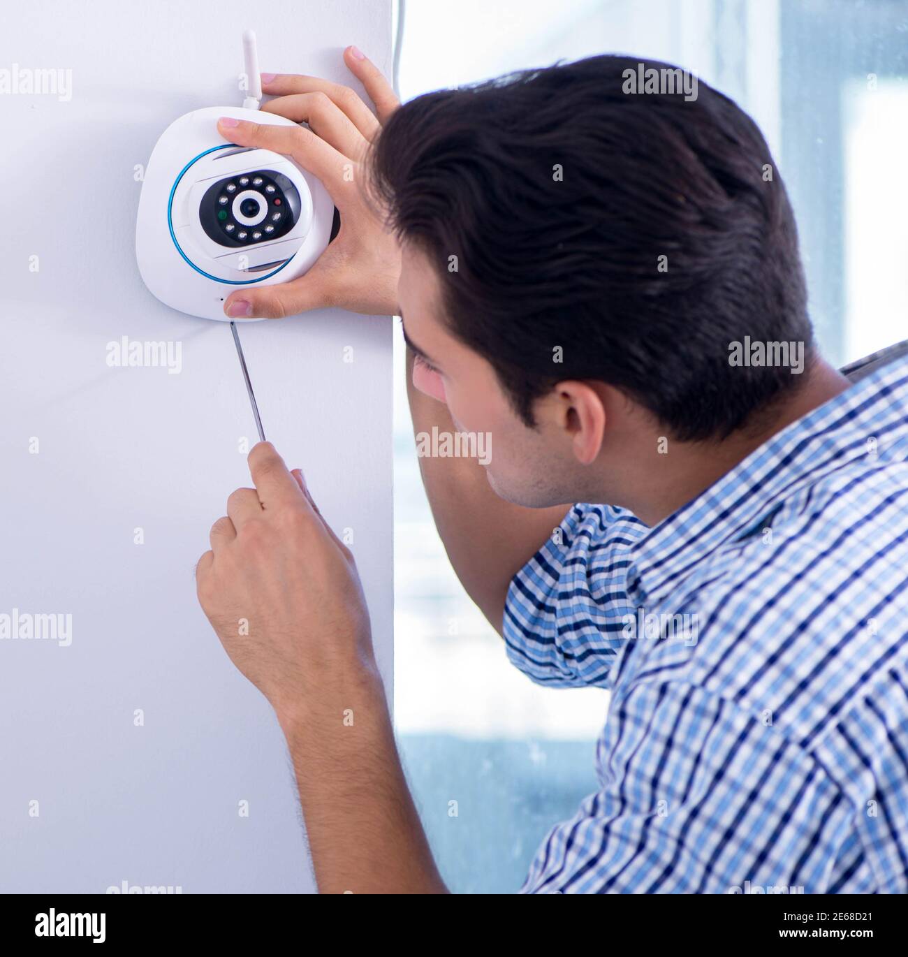 The man installing surveillance cctv cameras at home Stock Photo Alamy