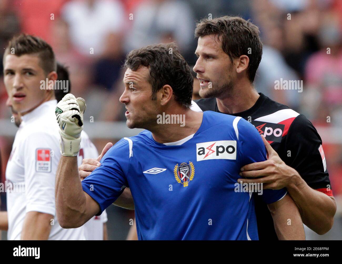 Neuchatel Xamax's Jean-Francois Bedenik (L) shouts towards an unidentified  team mate next to team mate Stephane Besle during their Super League soccer  match against FC Servette in Neuchatel August 14, 2011. REUTERS/Denis