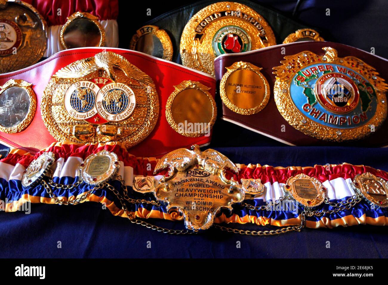 Boxing World Championship title belts held by heavyweight boxing title  holder Vladimir Klitschko of Ukraine (not pictured) are displayed at a news  conference in Paris October 24, 2011. Klitschko will fight French