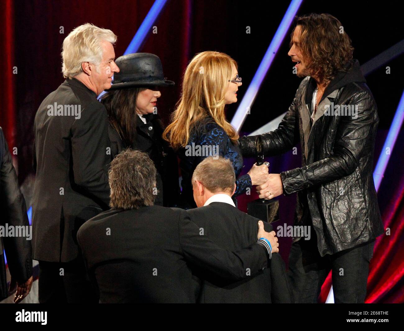 Ann and Nancy Wilson, of Heart, are greeeted by musician Chris Cornell  during their induction at the 2013 Rock and Roll Hall of Fame induction  ceremony in Los Angeles April 18, 2013.