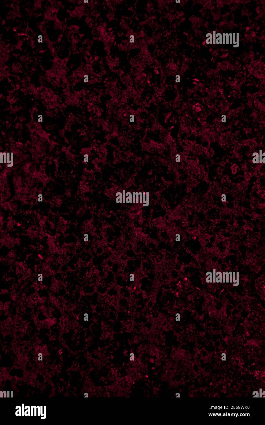 Crimson colored wall background with textures of different shades of