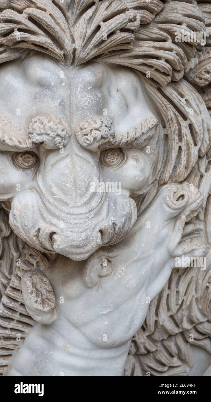 Ancient figure of a fearful lion killing a zebra in Rome, Italy, closeup, details Stock Photo