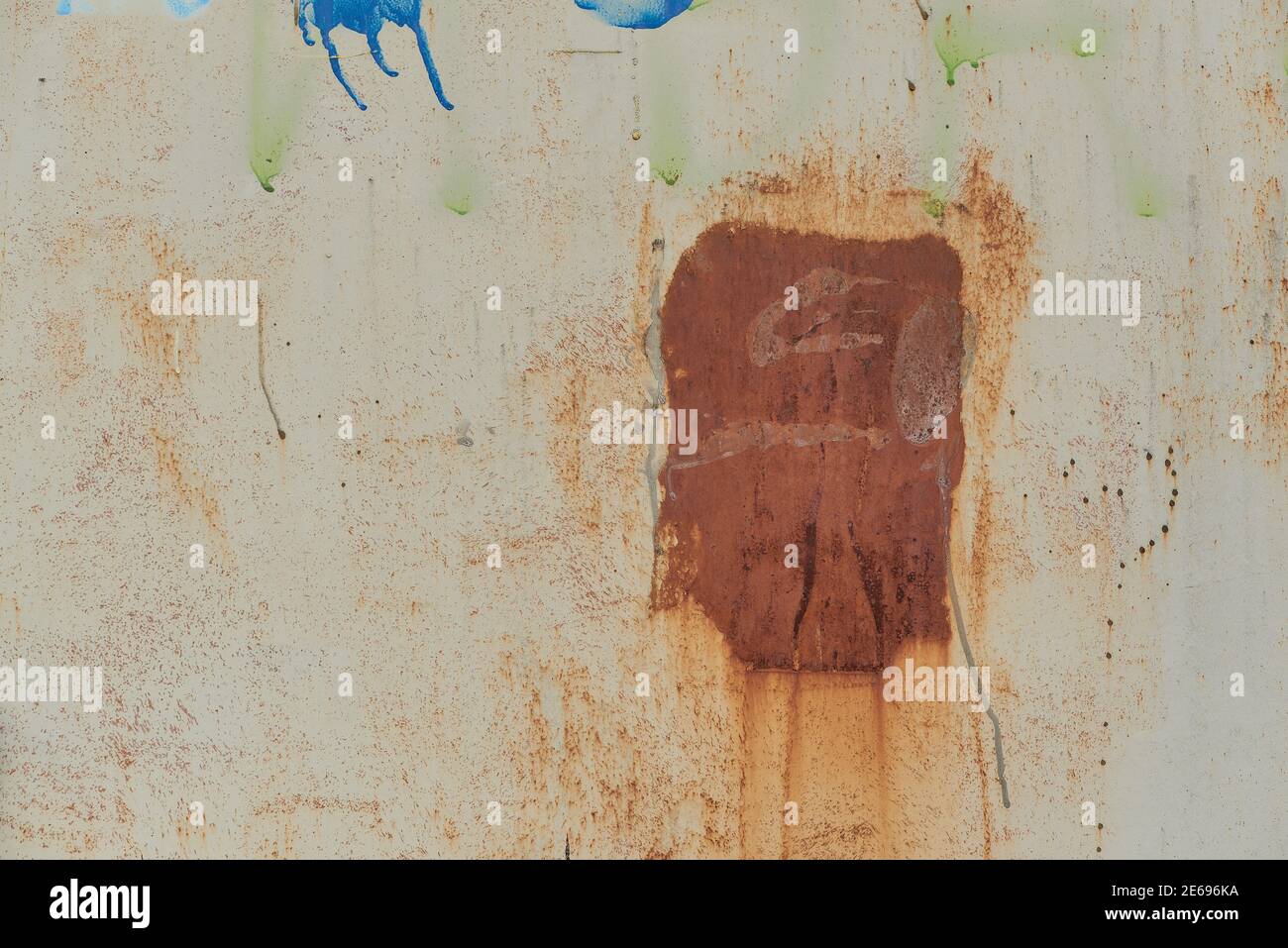Plate of metal with big rust spot texture traces of paint faint color ...