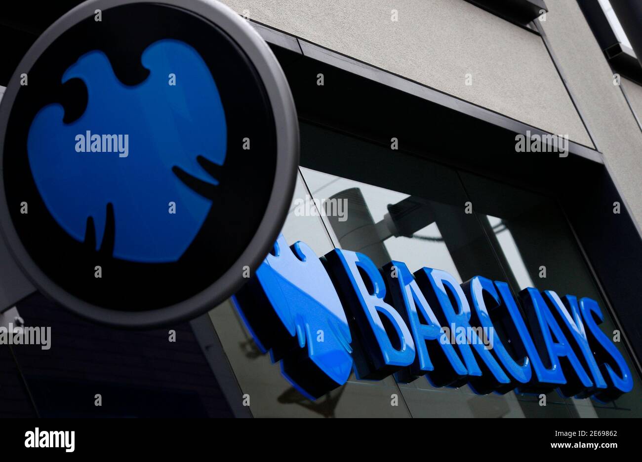 A logo of Barclays bank is seen outside a branch in Altrincham, northern England April 26, 2012. Barclays posted a 22 percent rise in first-quarter profit, ahead of market forecasts, as a strong rebound in revenue from its investment banking arm and a drop in bad debt countered increased compensation for insurance mis-selling.  REUTERS/Phil Noble (BRITAIN - Tags: BUSINESS EMPLOYMENT) Stock Photo