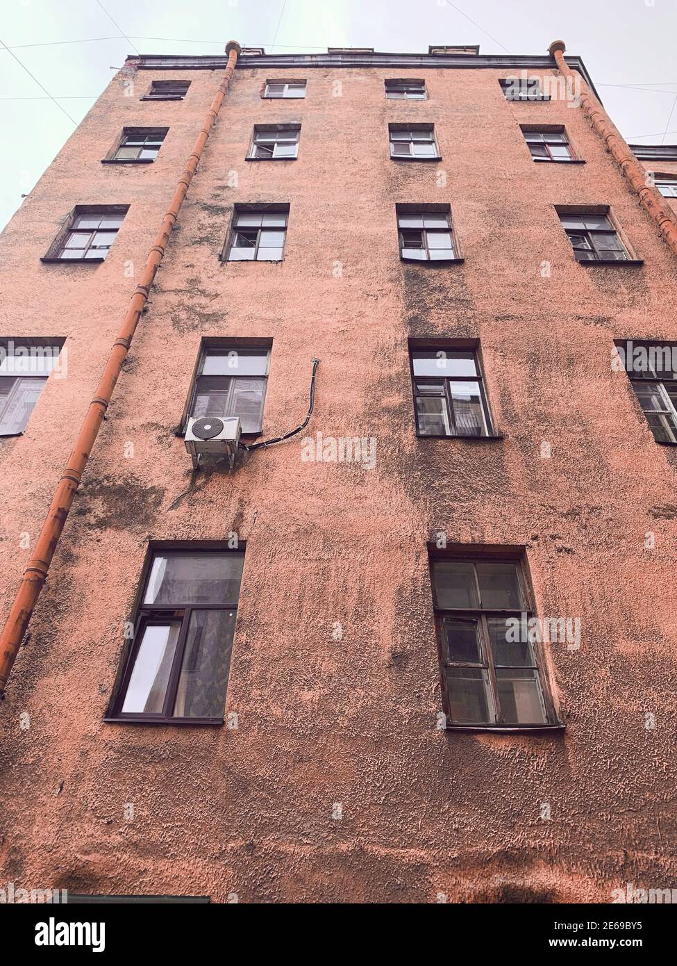 Bottom view of the outer wall of the house with lights Stock Photo
