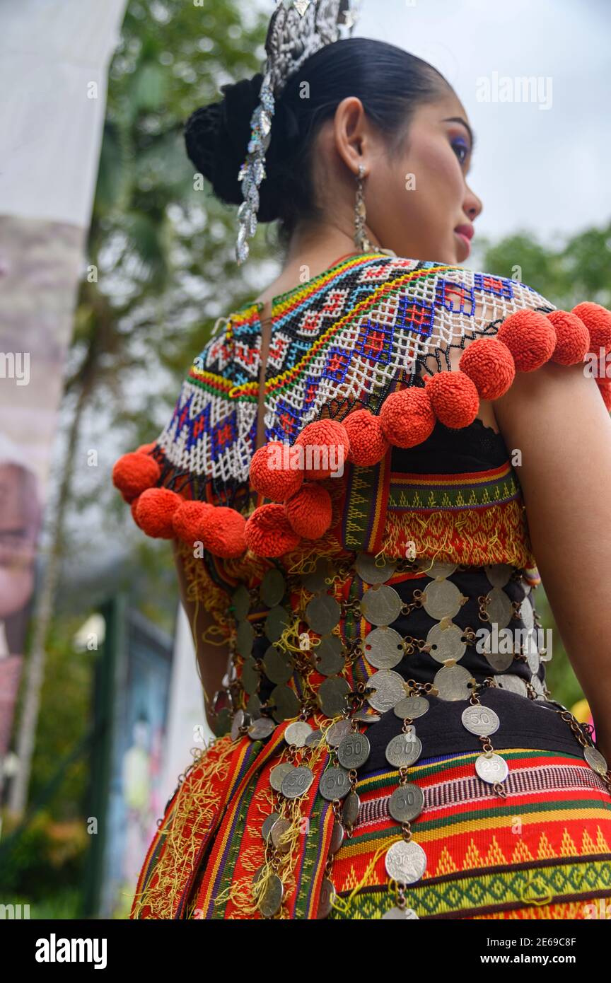 woman wearing traditional Iban clothes at the Sarawak Cultural Village Stock Photo