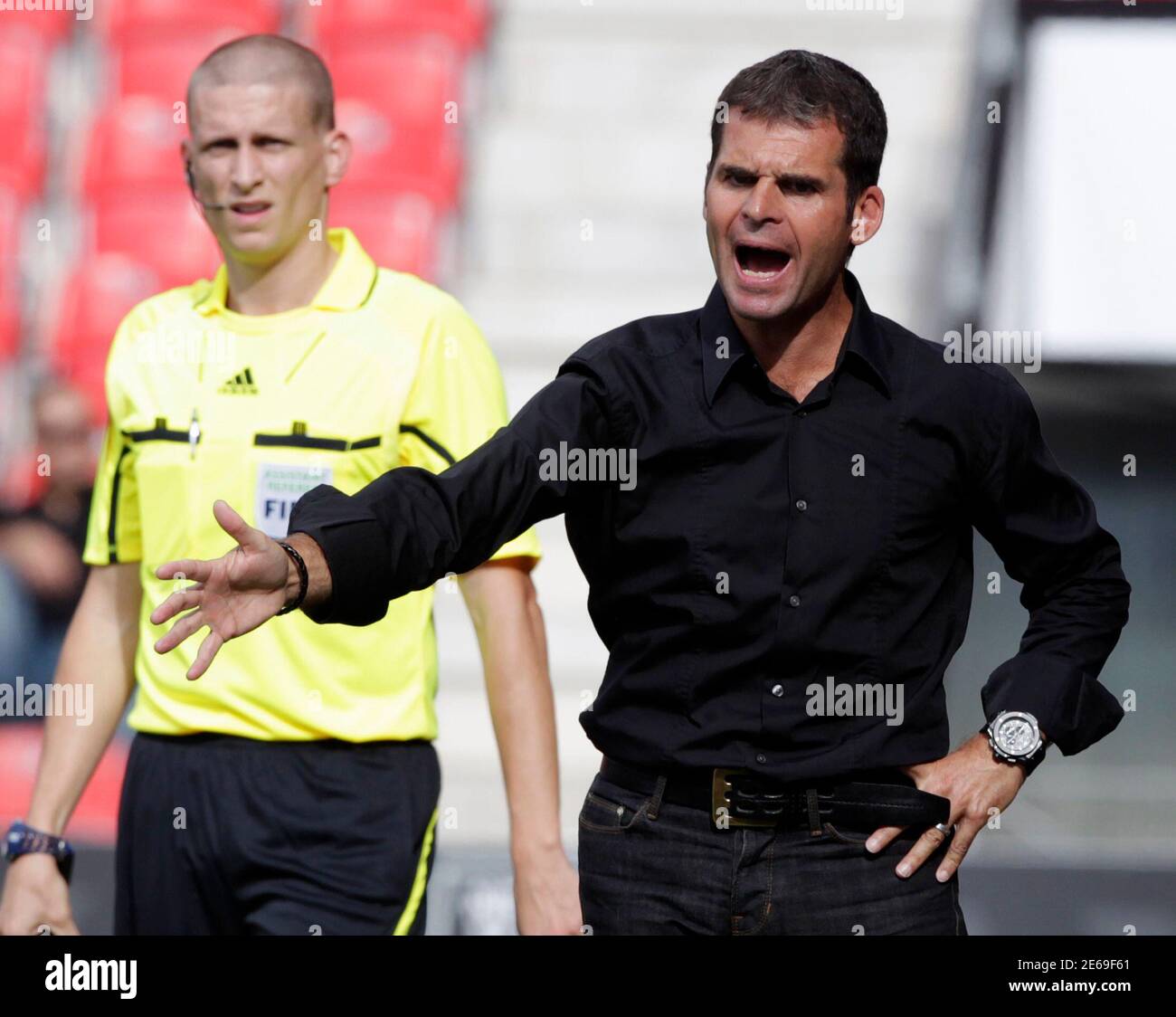 Neuchatel Xamax's coach Didier Olle-Nicolle gestures during their Swiss  Super League soccer match against FC St-Gallen in Neuchatel September 12,  2010. REUTERS/Denis Balibouse (SWITZERLAND - Tags: SPORT SOCCER Stock Photo  - Alamy