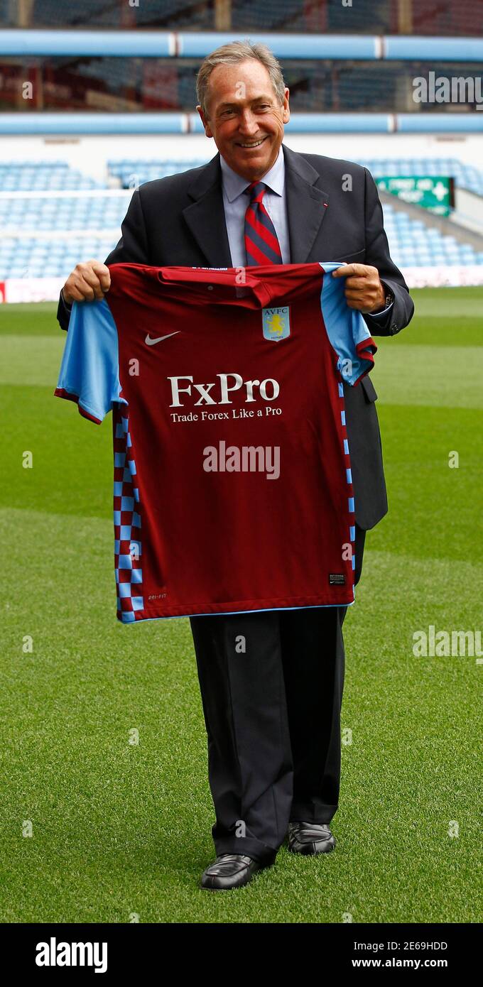English Premier League soccer team Aston Villa's new manager Gerard  Houllier poses with a jersey at Villa Park in Birmingham September 10,  2010. Former Liverpool and France coach Gerard Houllier returned to