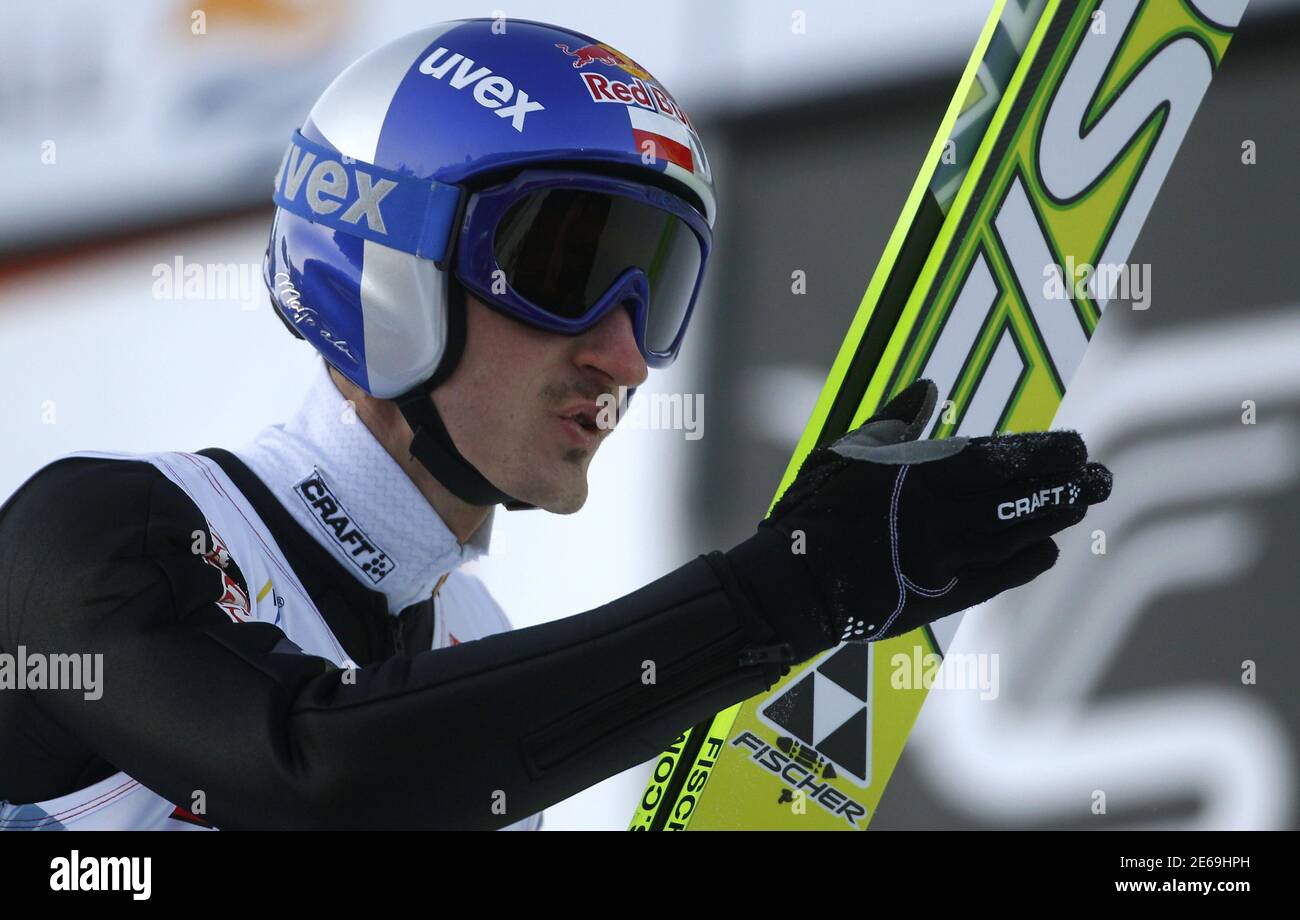 Poland's Adam Malysz blows a kiss towards a TV camera after taking the  second place in the third event of the Four-Hills ski jumping tournament in  Innsbruck, January 3, 2011. Austria's Thomas