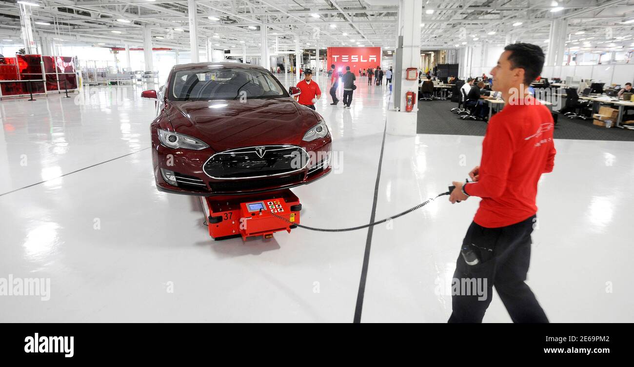 mark-cuyler-an-operations-manager-at-tesla-walks-a-model-s-through-the-company-s-factory-in-fremont-california-june-22-2012-tesla-began-delivering-the-electric-sedan-to-customers-on-june-22