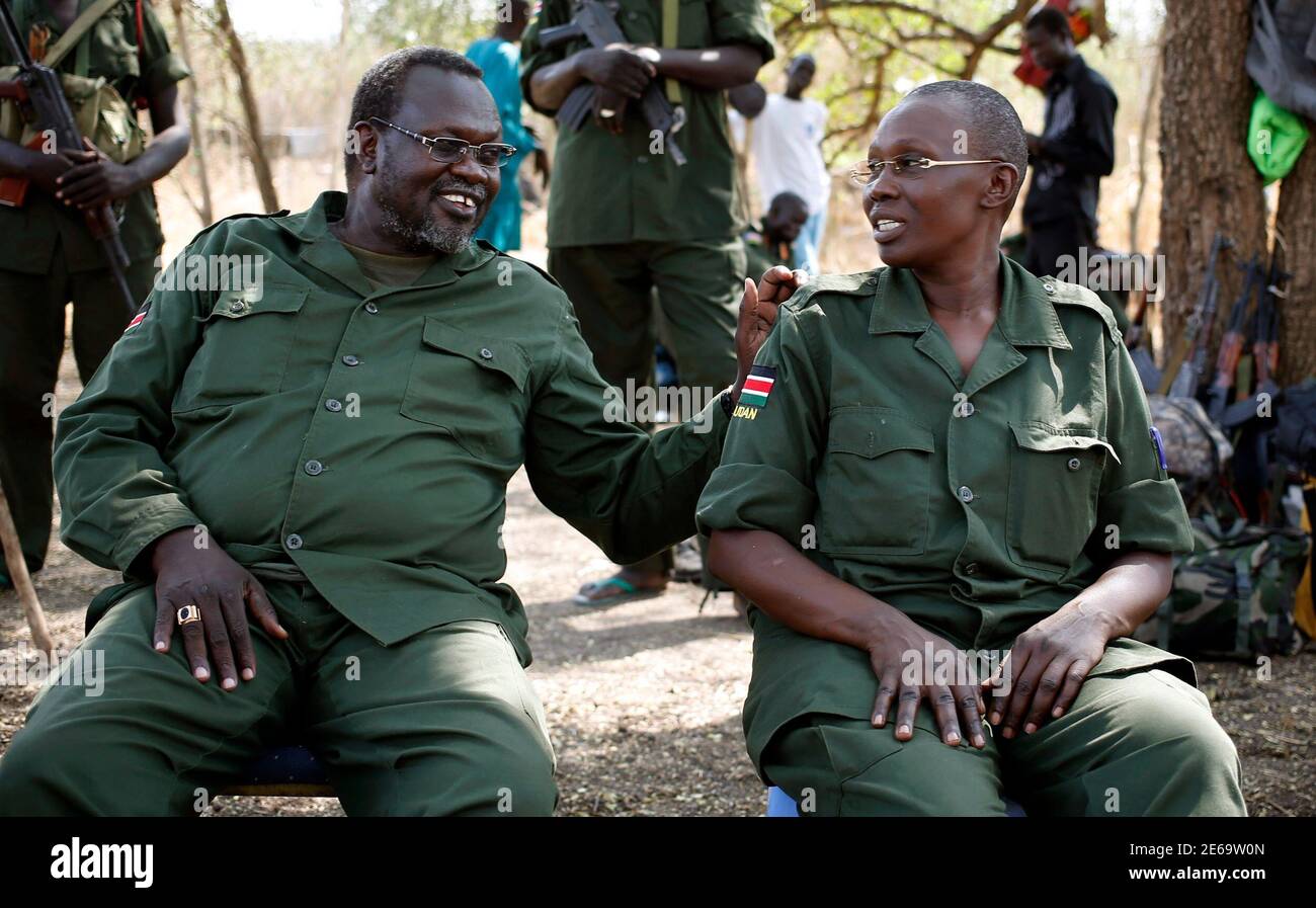South Sudan's rebel leader Riek Machar sits next to his wife Angelina Teny  in front of their tent in a rebel-controlled territory in Jonglei State  January 31, 2014. A regional African group