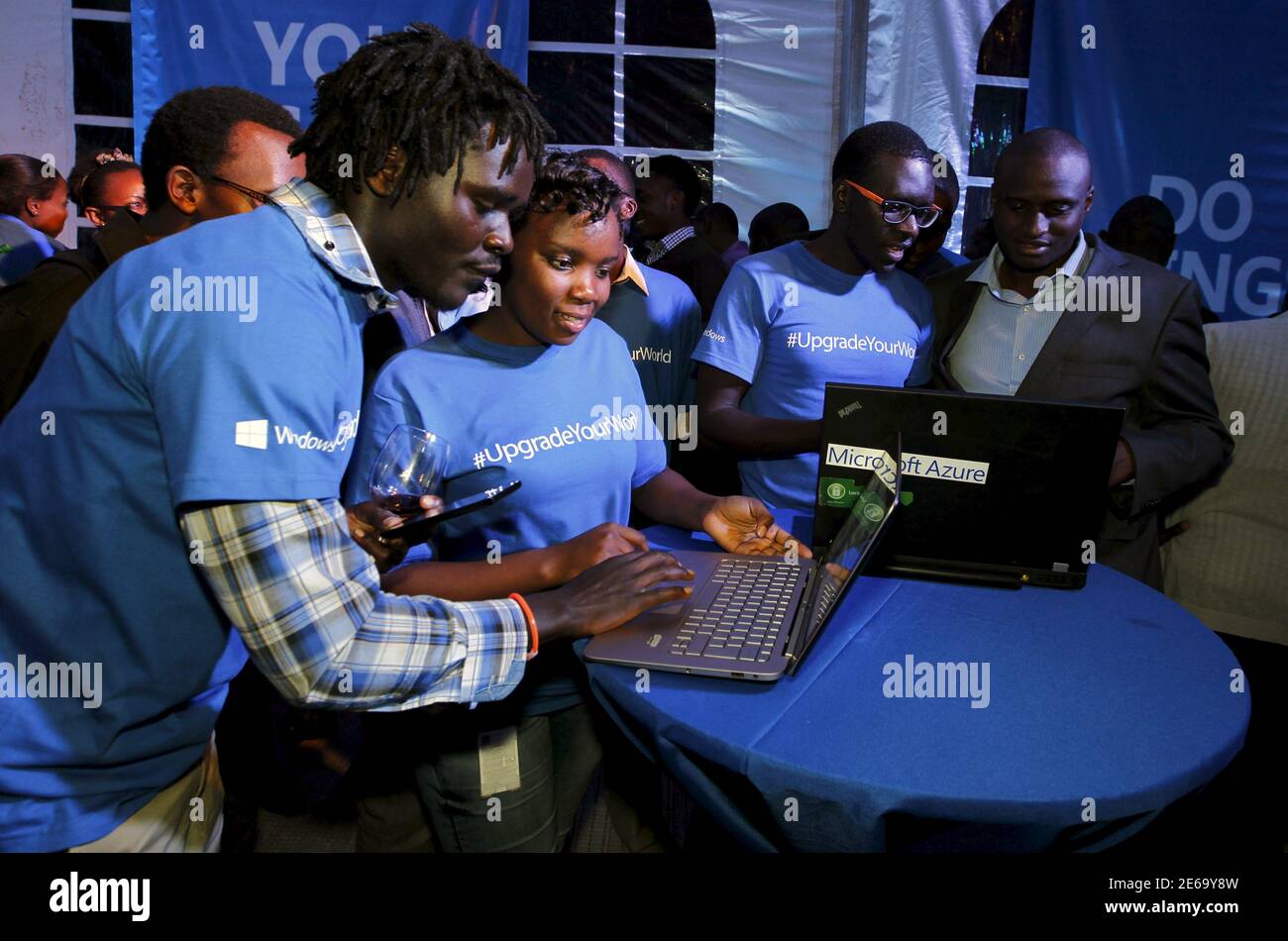 Microsoft delegates check applications in a computer during the launch of the Windows 10 operating system in Kenya's capital Nairobi, July 29, 2015. Microsoft Corp's launch of its first new operating system in almost three years, designed to work across laptops, desktop and smartphones, won mostly positive reviews for its user-friendly and feature-packed interface. REUTERS/Thomas Mukoya Stock Photo
