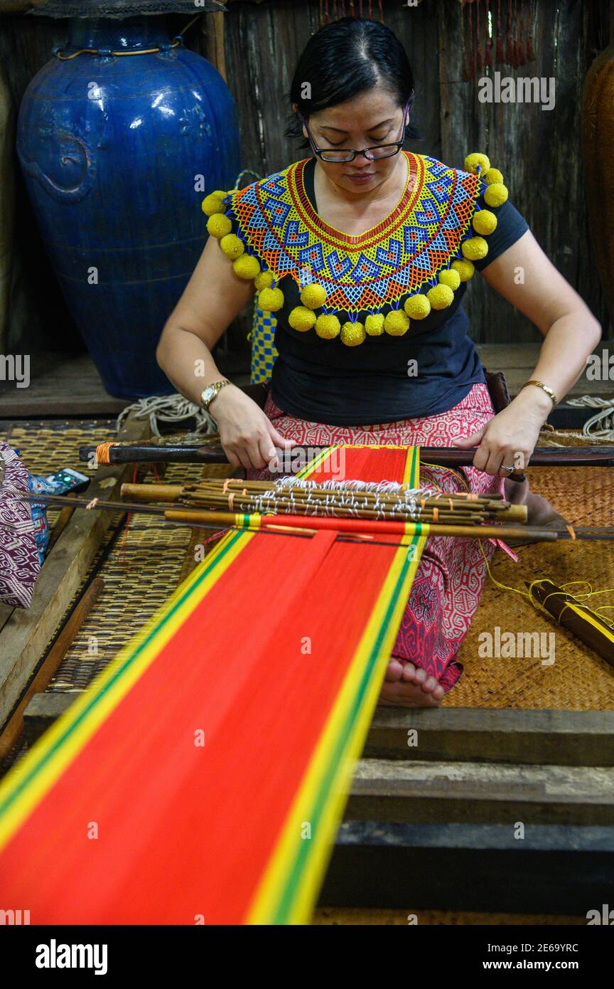 Iban woman doing Pau weaving Stock Photo