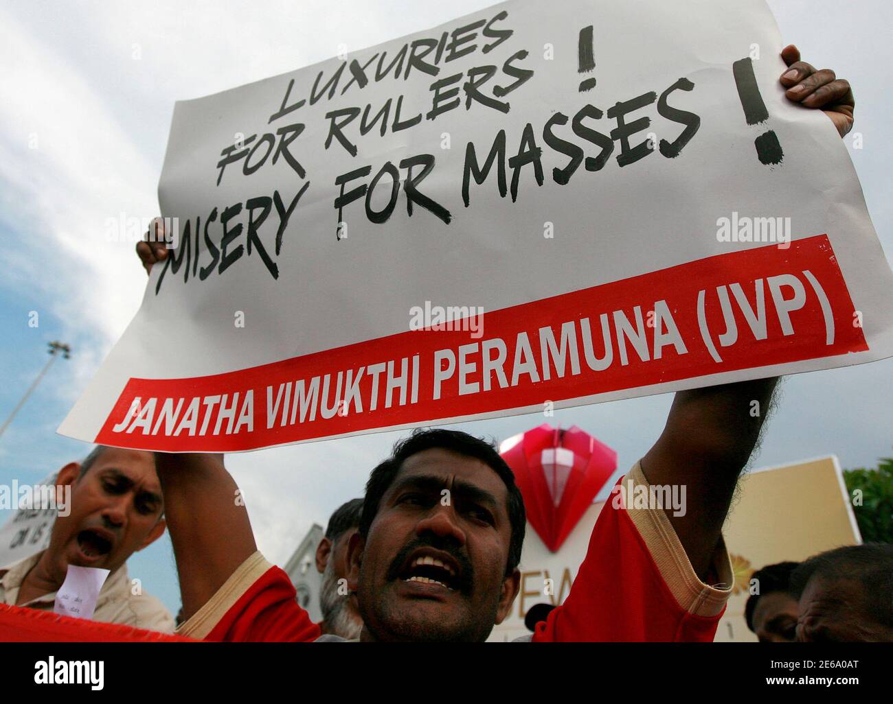an-opposition-supporter-holds-up-a-sign-during-a-protest-against-government-policies-in-colombo-november-18-2010-marxist-student-and-trade-unions-are-up-in-arms-against-the-sri-lankan-government-demanding-for-better-facilities-and-salary-hikes-reutersandrew-caballero-reynolds-sri-lanka-tags-politics-civil-unrest-2E6A0AT.jpg
