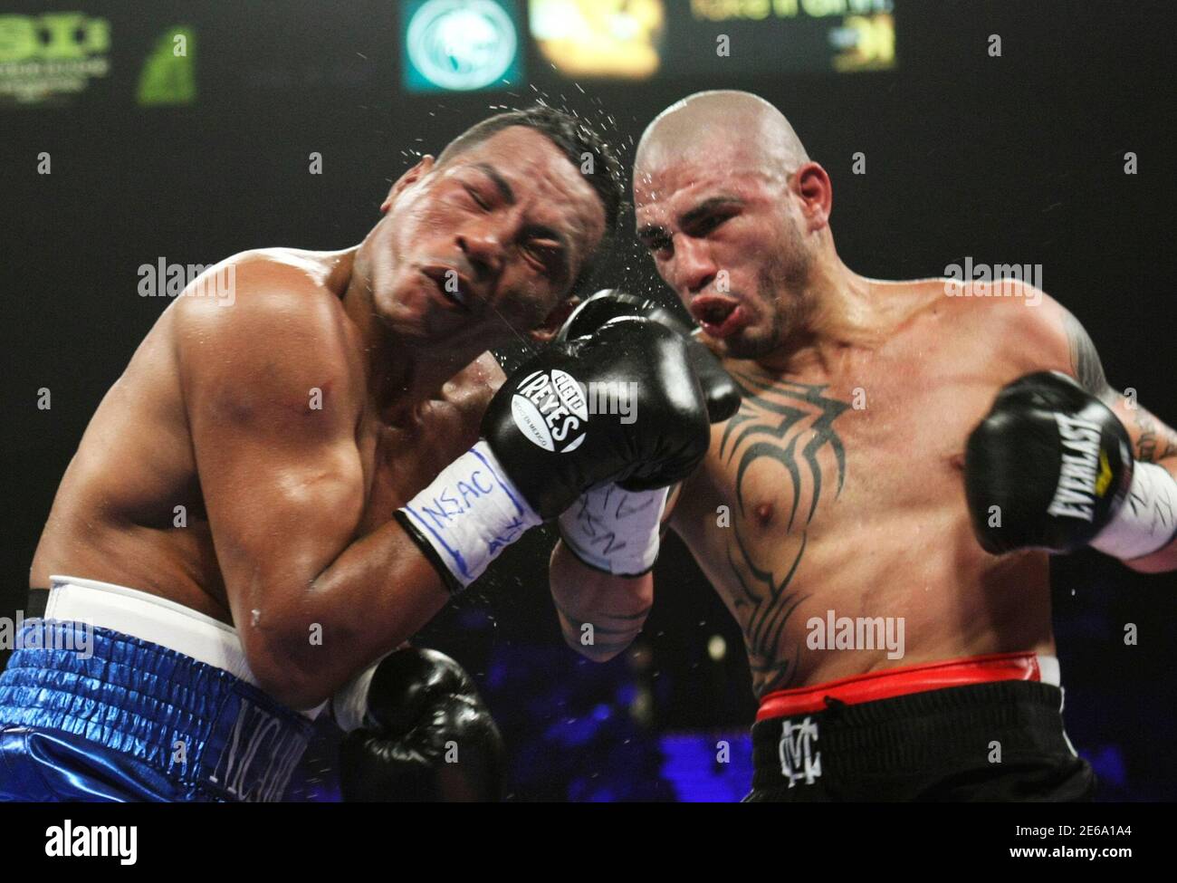 Ricardo Mayorga of Nicaragua (L) takes a punch from Miguel Cotto of Puerto  Rico during their WBA world super welterweight title fight at the MGM Grand  Garden Arena in Las Vegas, Nevada