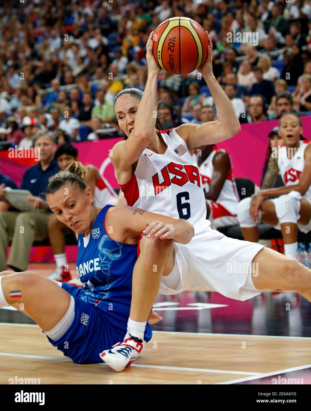 Sue Bird (R) of the U.S. tries to keep the ball away from France's Marion  Laborde during their women's gold medal basketball match at the North  Greenwich Arena during the London 2012