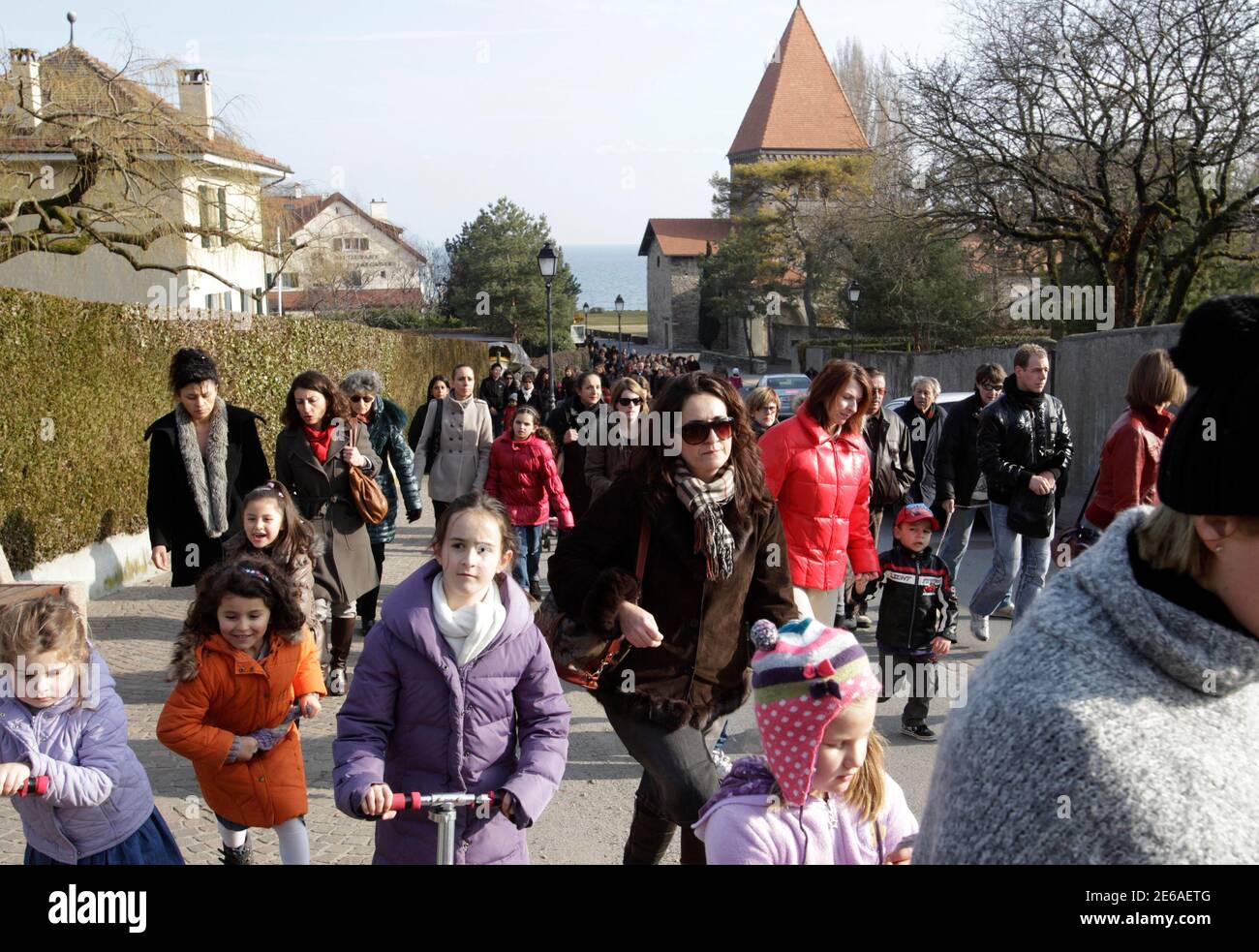 People Walk Through The Village During A Support Walk For Missing Six Year Old Twins Alessia And Livia Schepp In St Sulpice February 23 2011 Rescuers And Police From Italy Switzerland And France Are Still